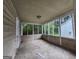 A sunroom with screened windows, providing natural light and fresh air at 6679 Cameron Rd, Morrow, GA 30260