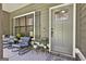 Cozy front porch featuring comfortable seating, potted plants, and a welcoming entrance at 211 Beavers Rd, Grantville, GA 30220
