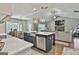 Beautiful kitchen with a large island, stainless steel appliances, and an open view to the living area at 211 Beavers Rd, Grantville, GA 30220