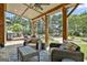 Covered back patio featuring an outdoor dining area and views of the pool and landscaped yard at 30 Dorset Ct, Sharpsburg, GA 30277