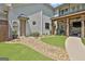 Landscaped backyard featuring a lush lawn, brick and stone walkway, and inviting outdoor spaces at 30 Dorset Ct, Sharpsburg, GA 30277