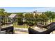 Balcony with wicker seating overlooking a green backyard, ideal for enjoying outdoor views and relaxation at 30 Dorset Ct, Sharpsburg, GA 30277