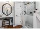 Elegant bathroom with a custom vanity area and glass-enclosed shower with beautiful tile work at 30 Dorset Ct, Sharpsburg, GA 30277