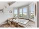 Bright bathroom with a relaxing soaking tub under a bay window, offering serene views and natural light at 30 Dorset Ct, Sharpsburg, GA 30277