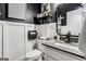 Powder room featuring modern design, a black wall and white wainscoting at 30 Dorset Ct, Sharpsburg, GA 30277