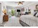Spacious primary bedroom with private balcony access and comfortable seating area at 30 Dorset Ct, Sharpsburg, GA 30277