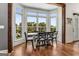 Dining area featuring hardwood floors, large windows and views of the yard at 30 Dorset Ct, Sharpsburg, GA 30277