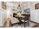 Dining room with hardwood floors, rug, coffered ceiling, chandelier and wainscoting at 30 Dorset Ct, Sharpsburg, GA 30277