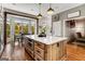 Bright kitchen with a large island, hardwood floors, stainless appliances, and a breakfast area with a bay window at 30 Dorset Ct, Sharpsburg, GA 30277