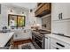 Charming kitchen with white cabinetry, stone countertops, and stainless steel appliances with designer touches at 30 Dorset Ct, Sharpsburg, GA 30277
