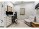 Functional home office with built-in cabinets, desk, chair, and artwork, perfect for a productive workspace at 30 Dorset Ct, Sharpsburg, GA 30277
