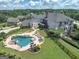 Aerial view of backyard featuring a custom pool with jacuzzi, surrounded by lush landscaping at 30 Dorset Ct, Sharpsburg, GA 30277
