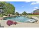 Stunning backyard pool featuring stone accents, a waterfall feature, and in-pool lounge chairs at 30 Dorset Ct, Sharpsburg, GA 30277