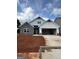 Charming new construction home featuring a stone facade and two-car garage at 11156 Cornerstone Way, Hampton, GA 30228