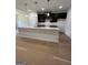 Modern kitchen featuring granite countertops, stainless steel appliances and sleek cabinetry with lots of space at 11156 Cornerstone Way, Hampton, GA 30228