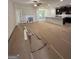Spacious living room with fireplace, seamlessly connected to a kitchen and dining area with abundant natural light at 11156 Cornerstone Way, Hampton, GA 30228