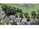 Aerial view showcasing luxurious homes in a golf community with lush green landscape and lake at 103 Golf Terrace Dr, Stockbridge, GA 30281