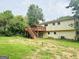 The backyard has a wooden deck with stairs at 1766 Tilden Ave, Jonesboro, GA 30236