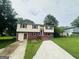 Charming two-story home with a well-maintained lawn and inviting entryway at 1766 Tilden Ave, Jonesboro, GA 30236