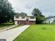 Charming two-story home with a well-maintained lawn and inviting entryway at 1766 Tilden Ave, Jonesboro, GA 30236