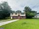 Charming two-story home with a well-maintained lawn and inviting entryway at 1766 Tilden Ave, Jonesboro, GA 30236