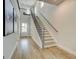 Inviting entryway with hardwood floors, staircase with iron balusters, and natural light at 37 Fraser Ln # 122B, Auburn, GA 30011