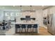 Gourmet kitchen with white cabinets, stainless steel appliances, and a large center island with barstool seating at 37 Fraser Ln # 122B, Auburn, GA 30011