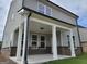 A covered patio features stylish white columns, offering an inviting outdoor space at 37 Fraser Ln # 122B, Auburn, GA 30011