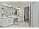 Well-lit bathroom boasting double sinks, white vanity, and stylish decor at 106 Lanyard Bnd, Peachtree City, GA 30269