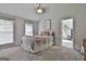 Bright bedroom featuring neutral walls, plush carpet, and a cozy bed with stylish decor at 106 Lanyard Bnd, Peachtree City, GA 30269