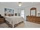 Bedroom features neutral carpet and walls with window, furniture and ceiling fan at 106 Lanyard Bnd, Peachtree City, GA 30269