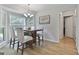 A dining room with seating for four near a large window overlooking greenery at 106 Lanyard Bnd, Peachtree City, GA 30269