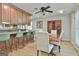 A dining room with a kitchen and bar area at 106 Lanyard Bnd, Peachtree City, GA 30269