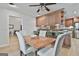 Dining area with an open kitchen and bar area at 106 Lanyard Bnd, Peachtree City, GA 30269