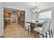 A dining room is adjacent to an open-concept kitchen with stainless appliances at 106 Lanyard Bnd, Peachtree City, GA 30269