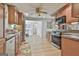 Cozy kitchen with wood cabinets, stainless steel appliances, granite countertops, and an eat-in dining area at 106 Lanyard Bnd, Peachtree City, GA 30269