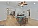Bright and inviting living room with light wood floors and a desk area at 106 Lanyard Bnd, Peachtree City, GA 30269