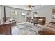 Cozy living room with windows and comfortable seating for entertaining guests at 106 Lanyard Bnd, Peachtree City, GA 30269