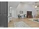 Inviting living room with high ceilings, wood floors, a cozy seating area, and decorative accents and furnishings at 106 Lanyard Bnd, Peachtree City, GA 30269