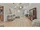 Light-filled living room boasts vaulted ceiling, wood floors, comfortable sectional sofa, and a stylish media center at 106 Lanyard Bnd, Peachtree City, GA 30269