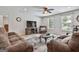 Comfortable living room featuring plush sofas, a ceiling fan, and natural light at 106 Lanyard Bnd, Peachtree City, GA 30269