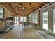 Partially finished sun room space with unfinished walls and many windows at 106 Lanyard Bnd, Peachtree City, GA 30269