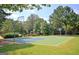 Community basketball court surrounded by lush green trees at 115 Sunderland Cir, Fayetteville, GA 30215