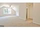 Carpeted bonus room with walk-in closet, angled ceiling and ceiling fan at 115 Sunderland Cir, Fayetteville, GA 30215