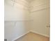 Walk-in closet featuring carpeted floor and wire shelving for storage at 115 Sunderland Cir, Fayetteville, GA 30215
