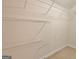 Walk-in closet with built-in wire shelving at 115 Sunderland Cir, Fayetteville, GA 30215