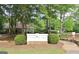 Stonebriar Park sign amid lush greenery, promoting a welcoming and serene community environment at 115 Sunderland Cir, Fayetteville, GA 30215