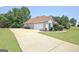 Home with attached garage, concrete driveway, and well-maintained yard at 115 Sunderland Cir, Fayetteville, GA 30215