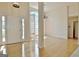 Bright foyer features hardwood floors, a large window with shutters and a front door with sidelight window at 115 Sunderland Cir, Fayetteville, GA 30215