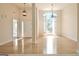 Bright foyer features hardwood floors, a large window with shutters and a front door with sidelight window at 115 Sunderland Cir, Fayetteville, GA 30215